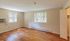 Bright and airy room showcasing elegant wooden floors, large windows offering scenic views, and ample natural light.Your spacious kitchen offers generous square footage with room for multiple people and all your cooking essentials.  | The Royal Crest | Apartment in,North Andover MA