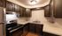 Inviting kitchen with rich wood cabinetry, modern stainless steel appliances, and ample countertop space.Your spacious kitchen offers generous square footage with room for multiple people and all your cooking essentials.  | The Royal Crest | Apartment in,North Andover MA