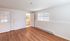Bright bedroom with hardwood floors, large window, and a glimpse into an inviting bathroom.Your spacious kitchen offers generous square footage with room for multiple people and all your cooking essentials.  | The Royal Crest | Apartment in,North Andover MA