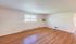 Bright and inviting living space with natural light, featuring elegant wood flooring and a large window for a serene view.Your spacious kitchen offers generous square footage with room for multiple people and all your cooking essentials.  | The Royal Crest | Apartment in,North Andover MA