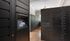 Modern package room featuring sleek black parcel lockers with a digital screen for secure and convenient deliveries | The Royal Crest | Apartment in North Andover, MA.