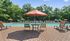 Your resort-style swimming pool features an expansive sundeck and sparkling water, offering the perfect oasis for summer relaxation. | The Royal Crest | Apartment in North Andover, MA