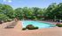 A resort-inspired pool area offers a refreshing escape with crystal clear water and professionally landscaped surrounds. | The Royal Crest | Apartment in North Andover, MA