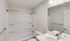 Sleek and modern bathroom with a pristine white bathtub, elegant vanity, and polished chrome fixtures.Your spacious kitchen offers generous square footage with room for multiple people and all your cooking essentials.  | The Royal Crest | Apartment in,North Andover MA