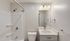 Modern bathroom with sleek design featuring a stylish vanity, pristine white shower, and elegant lighting.Your spacious kitchen offers generous square footage with room for multiple people and all your cooking essentials.  | The Royal Crest | Apartment in,North Andover MA