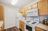 This prep-friendly kitchen maximizes workspace and storage with thoughtful layout designed for efficient cooking.  | Village Green | Tewksbury Apartments
