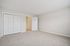 Bright and airy bedroom with plush carpet and double closets, ready for your stylish touch.| Village Green | Apartment in Tewksbury, MA
