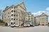 The professional building design features modern siding and large windows, reflecting a high standard of suburban living. | Village Green | Apartment in Tewksbury, MA