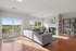 This spacious living room offers plenty of room for relaxation and entertaining with flexible layout options.