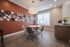 The comfortable dining area offers relaxed space for daily meals and casual entertaining with family and friends. | Mill & 3 Apartments | Apartment in Chelmsford, MA