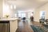 The pleasant living room creates a warm and comfortable atmosphere perfect for daily relaxation. | Mill & 3 Apartments | Apartment in Chelmsford, MA
