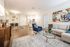 This spacious living room offers plenty of room for relaxation and entertaining with flexible layout options. | Mill & 3 Apartments |