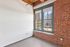 The well-proportioned living room offers versatile space for relaxation, entertainment, and personal expression. | 381 Congress Lofts | Apartment in, Boston MA