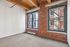 Your comfortable bedroom features large windows that fill the space with abundant natural light. | 381 Congress Lofts | 381 Congress Lofts Apartments