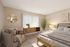 Cozy and elegant bedroom with warm lighting, featuring a plush armchair, sleek wooden furniture, and a lush potted plant for a serene ambiance.