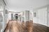 Spacious, modern apartment with sleek wood flooring, stainless steel appliances, and ample natural light.