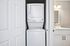 Compact apartment feature with in-unit laundry and modern bathroom, optimizing space and convenience.