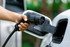 Close-up of an electric vehicle charging, showcasing modern eco-friendly technology in action.