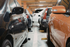 Well-lit underground parking garage showcasing organized parking with assorted modern cars, ensuring ample space and security.