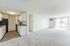 Bright, open-concept living area opening to a private balcony.