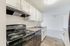 Bright galley kitchen with beautiful shaker cabinetry