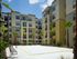 Lark Central Florida Exterior | Beach Volleyball net | Palm trees | Next to building