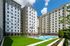 Modern apartment complex with a pristine outdoor pool and lush green lawn, perfect for luxury living.