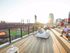 Balpark Village apartments featuring a sky deck with views of Busch Stadium