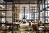 This is the Midland Lofts Club Level in downtown Kansas City. Residents can find an entertaining kitchen, coworking spaces, and a game lounge.