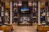 Luxurious modern lounge with elegant chandeliers, cozy fireplace, and stylish leather seating, offering a welcoming ambiance.