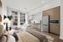 Modern studio apartment with a cozy bed, sleek kitchen, and comfortable seating, enhanced by natural light through large windows.