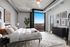 Luxurious bedroom with modern industrial design, stunning skyline view, and chic decor featuring abstract art and cozy bedding.