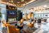 Chic luxury apartment lounge with modern decor, cozy leather seating, and a sleek fireplace, perfect for relaxation and social gatherings.