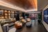 Luxurious lounge area with elegant seating, ambient lighting, and a stylish pool table, showcasing sophisticated modern interior design.