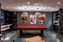 Chic game room featuring a red felt pool table, stylish pendant lights, and movie-themed decor.