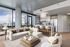 Luxurious open-plan living room with modern decor, floor-to-ceiling windows offering stunning city views, and a sleek kitchen with high-end finishes.