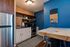 blue accent wall in a studio apartment
