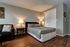 bed and closet at Greenway Studios