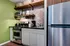 refrigerator and kitchen in studio apartment