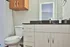 bathroom sink and toilet in studio apartment