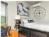 Bed, lamp, and decorations in furnished studio apartment
