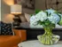 Blue flowers on coffee table in studio apartment
