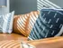 Decorative pillows on an orange leather couch