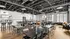 Bright and spacious dining area with modern industrial design and large windows.