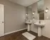 Elegant bathroom with dual sinks, large mirrors, and stylish lighting for a luxurious touch.