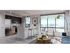 Modern Kitchen with State-of-the-art Whirlpool® Appliances Beautiful Light Fixtures & Spacious Living Room Area with a View |  Apartments for Rent in Downtown Miami | Grand Station