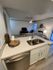 Upgraded Kitchen Counter & Living Area at Trailpoint at the Woodlands