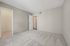 Spacious bedroom with soft carpeting and fresh neutral walls, ready for personal touches in a modern apartment at Driscoll Place.