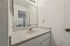Bathroom vanity with a sleek countertop at Driscoll Place Apartments.