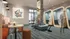 Modern co-working space featuring cozy seating, individual work pods, and vibrant artwork, offering a perfect blend of productivity and relaxation.